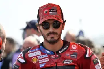 Pecco Bagnaia sorride a denti stretti